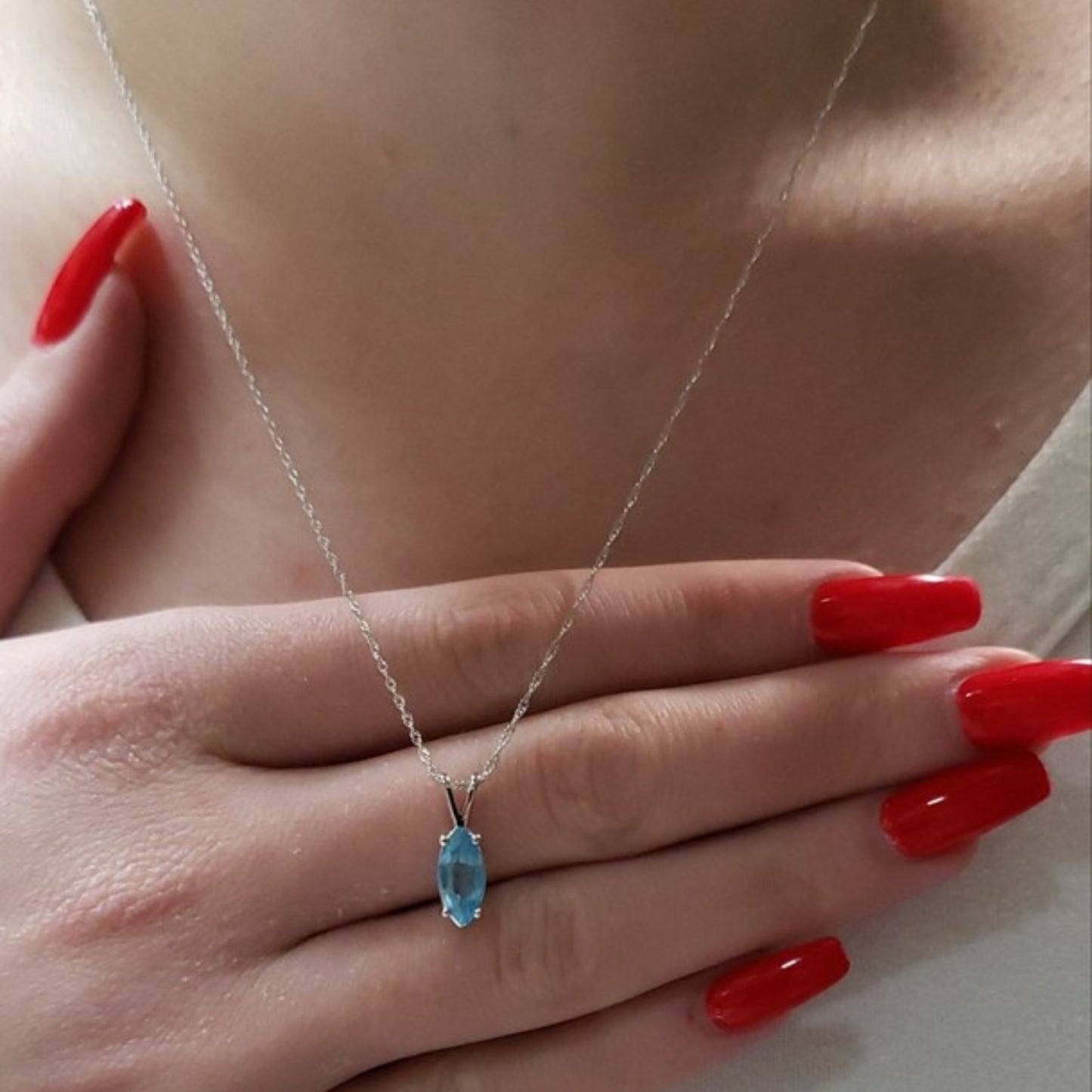 14Kt Gold Blue Topaz Marquise Pendant