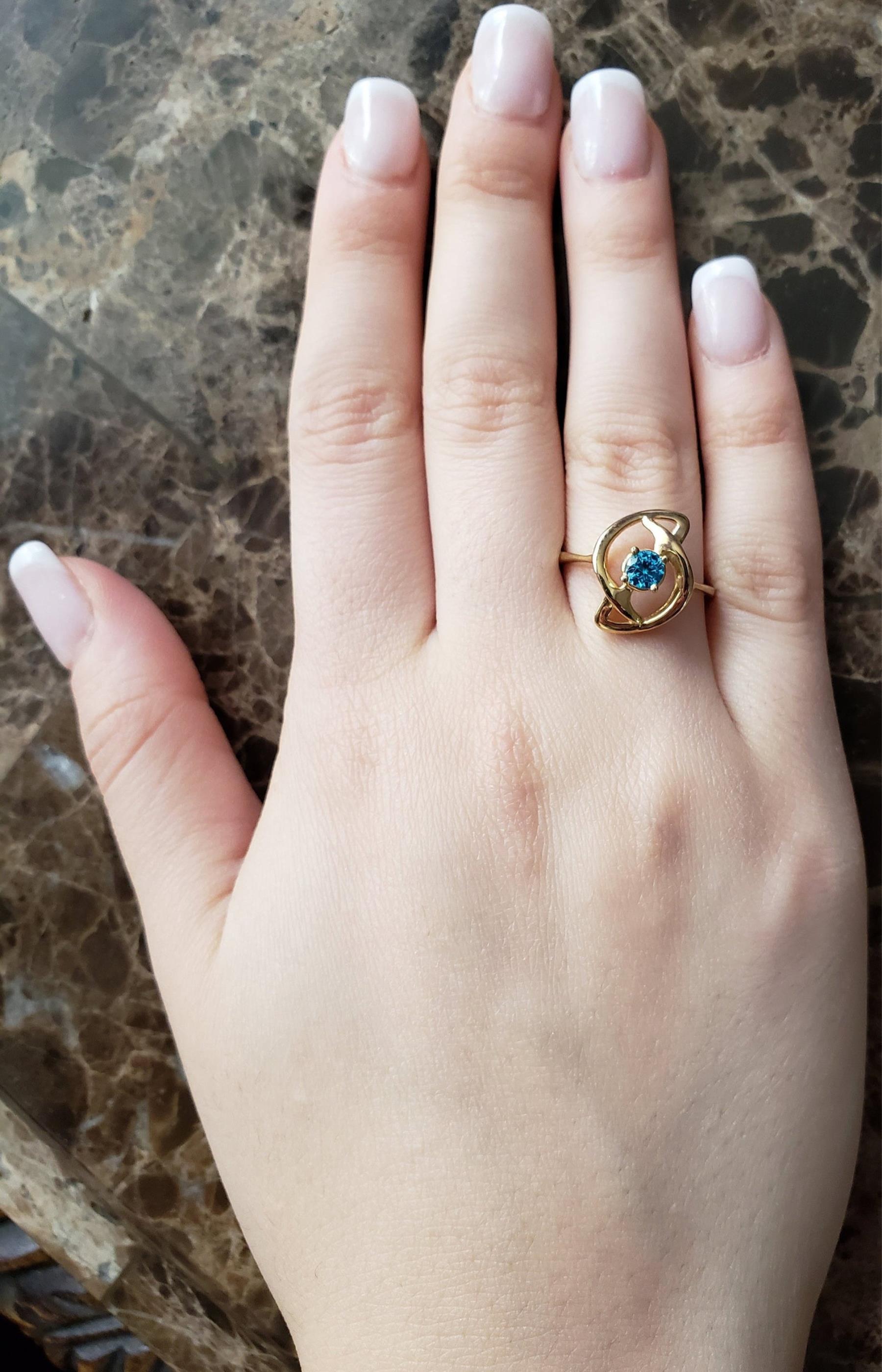 14Kt Gold Swiss Blue Topaz Infinity Design Ring