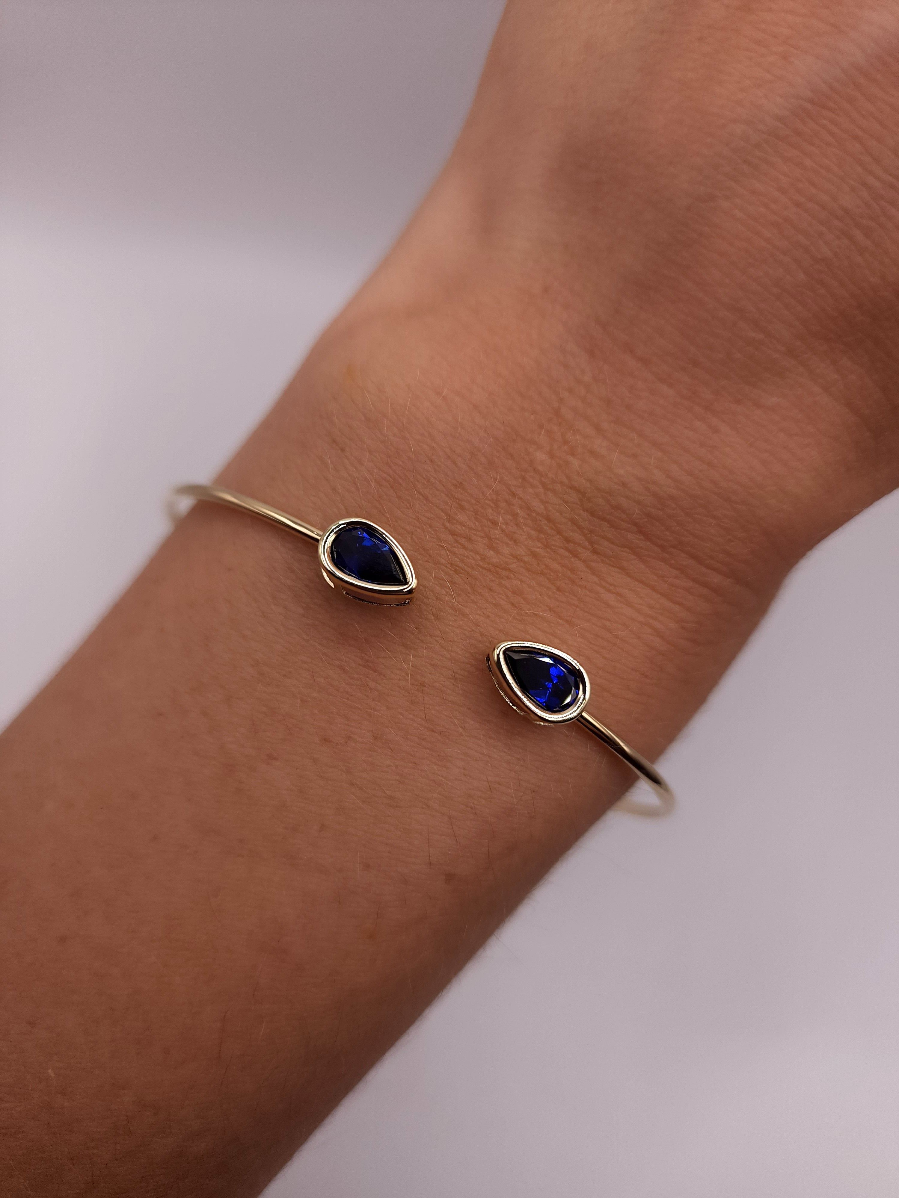 14Kt Gold Blue Sapphire Pear Bezel Bangle Bracelet